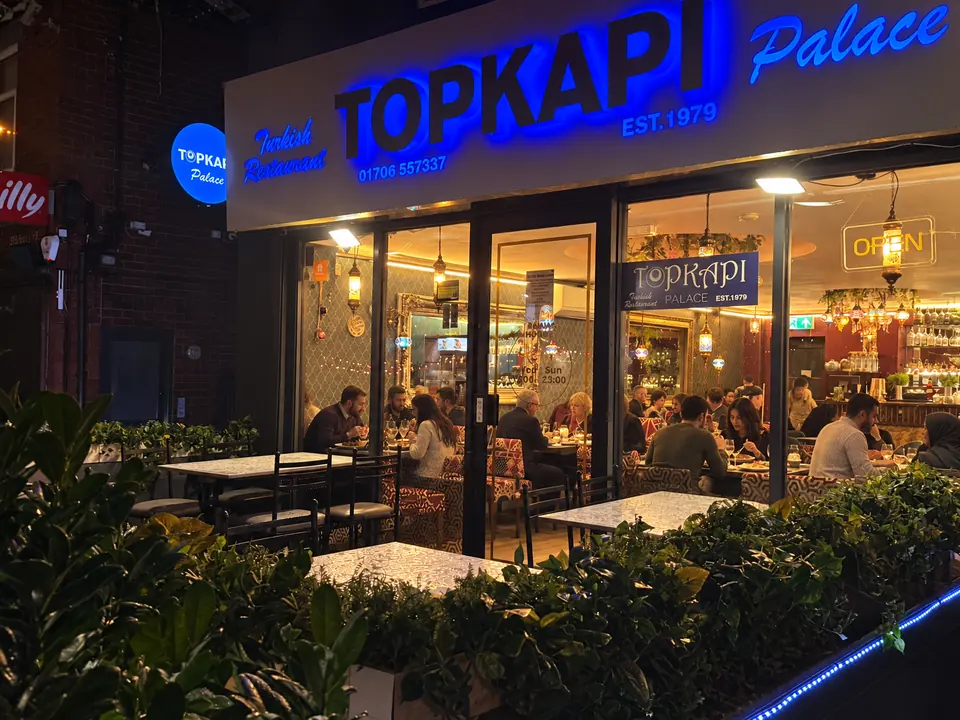 The terrace and front windows at night